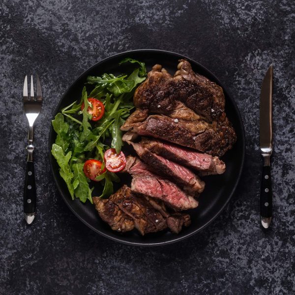 grilled-beef-steak-with-spices-on-a-black-plate-1.jpg